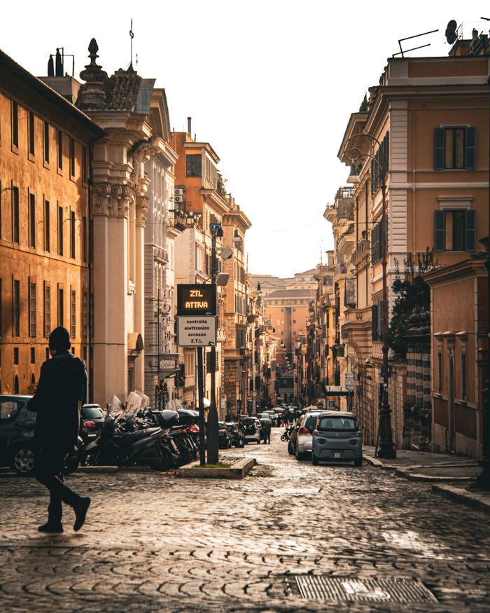 Captivating urban street scene in Rome's historic district during day, showcasing classic architecture.